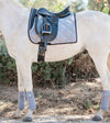 Standard Issue Equestrian Gray Dressage Bundle on a white arabian horse. Gray horse is tacked up with a saddle ontop of the gray dressage saddle pad. The polo wraps are wrapped on the legs. Off camera is the gray fly veil. Gray in color with semi shiny material.
